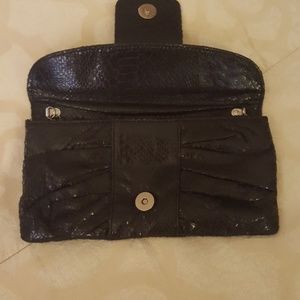 Jeweled holdover crossbody clutch in black